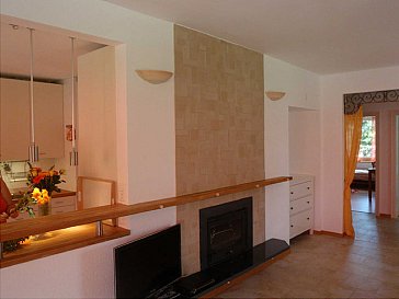 Ferienwohnung in Ascona - Wohnzimmer mit Cheminée