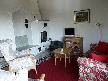 Ferienwohnung in Lenzerheide - Wohnzimmer mit Schwedenofen