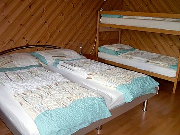 Ferienwohnung in Frutigen - Schlafzimmer mit 4 Betten