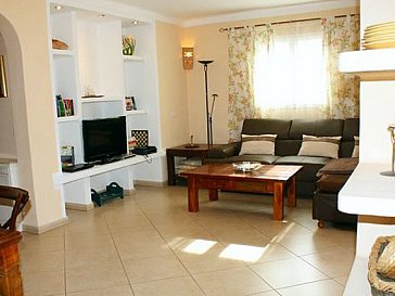 Ferienhaus in Sa Ràpita - Wohnzimmer mit Sat-Tv, Eckcouch