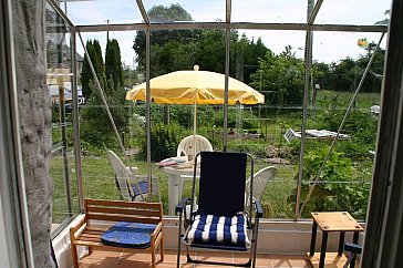 Ferienwohnung in Ver - Der Wintergarten und der Aussen-Sitzplatz