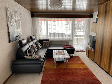 Ferienwohnung in Davos - Wohnzimmer mit Schrankbetten