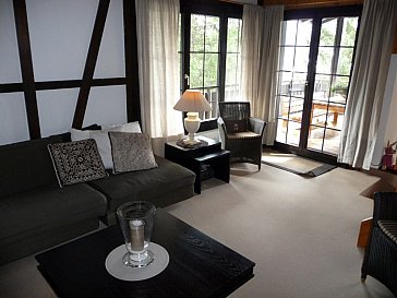 Ferienhaus in Lenzerheide - Wohnzimmer zur Südterrasse