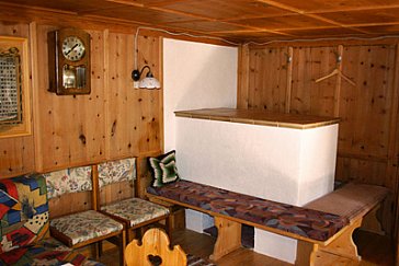 Ferienhaus in Kappl - Der Kachelofen in der Hüttenstube