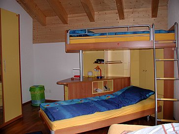 Ferienwohnung in Leukerbad - Schlafzimmer mit 3-4 Betten