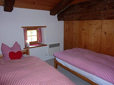 Ferienhaus in Lenzerheide - Schlafzimmer mit 2 Einzelbetten