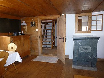 Ferienhaus in Lenzerheide - Wohnzimmer Ofen