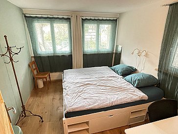 Ferienwohnung in Kandersteg - Schlafzimmer 1 mit Bett 2x 90/200