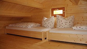 Ferienhaus in Füssen - Eine Raumspartreppe führt hinauf zum Schlaflager