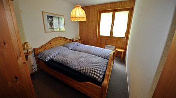 Ferienwohnung in Blitzingen - Schlafzimmer 1 mit blauer Bettwäsche