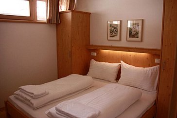 Ferienhaus in Wald im Pinzgau - Blick in ein Schlafzimmer