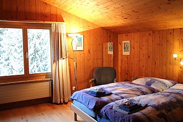 Ferienwohnung in Davos - Schlafzimmer mit Doppelbett 1
