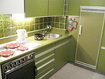 Ferienwohnung in Klosters - Küchenecke mit Herd/Oven/Kühlschrank