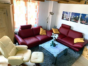 Ferienwohnung in Laax - Polstergruppe im Wohnzimmer