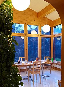 Ferienhaus in Lumbrein - Wintergarten mit Aussicht auf die Traumlandschaft
