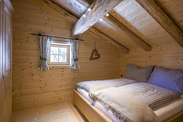 Ferienhaus in Kelchsau - Blick in ein Schlafzimmer