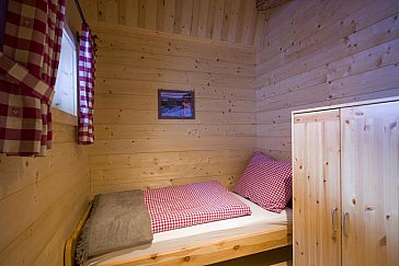 Ferienhaus in Kelchsau - Blick in ein Schlafzimmer