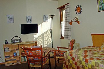 Ferienwohnung in Ascona - Wohnzimmer, Sitzgruppe, TV & Radio