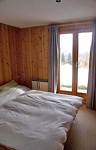 Ferienhaus in Les Collons - Schlafzimmer mit Doppelbett